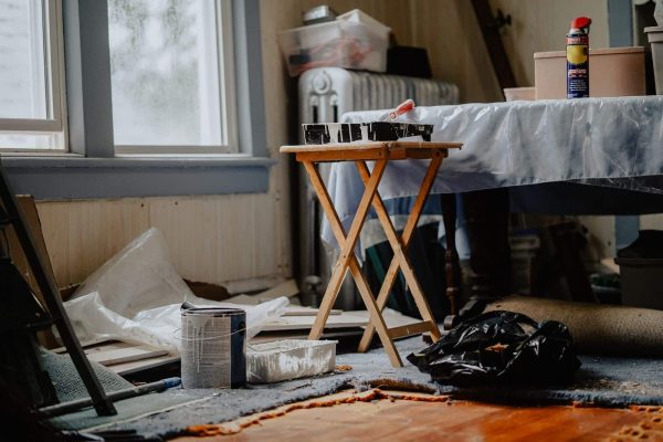 Home renovation in progress with paint supplies on a work table